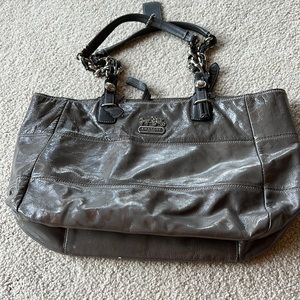 Coach shiny grey bag with a little discoloration on front.